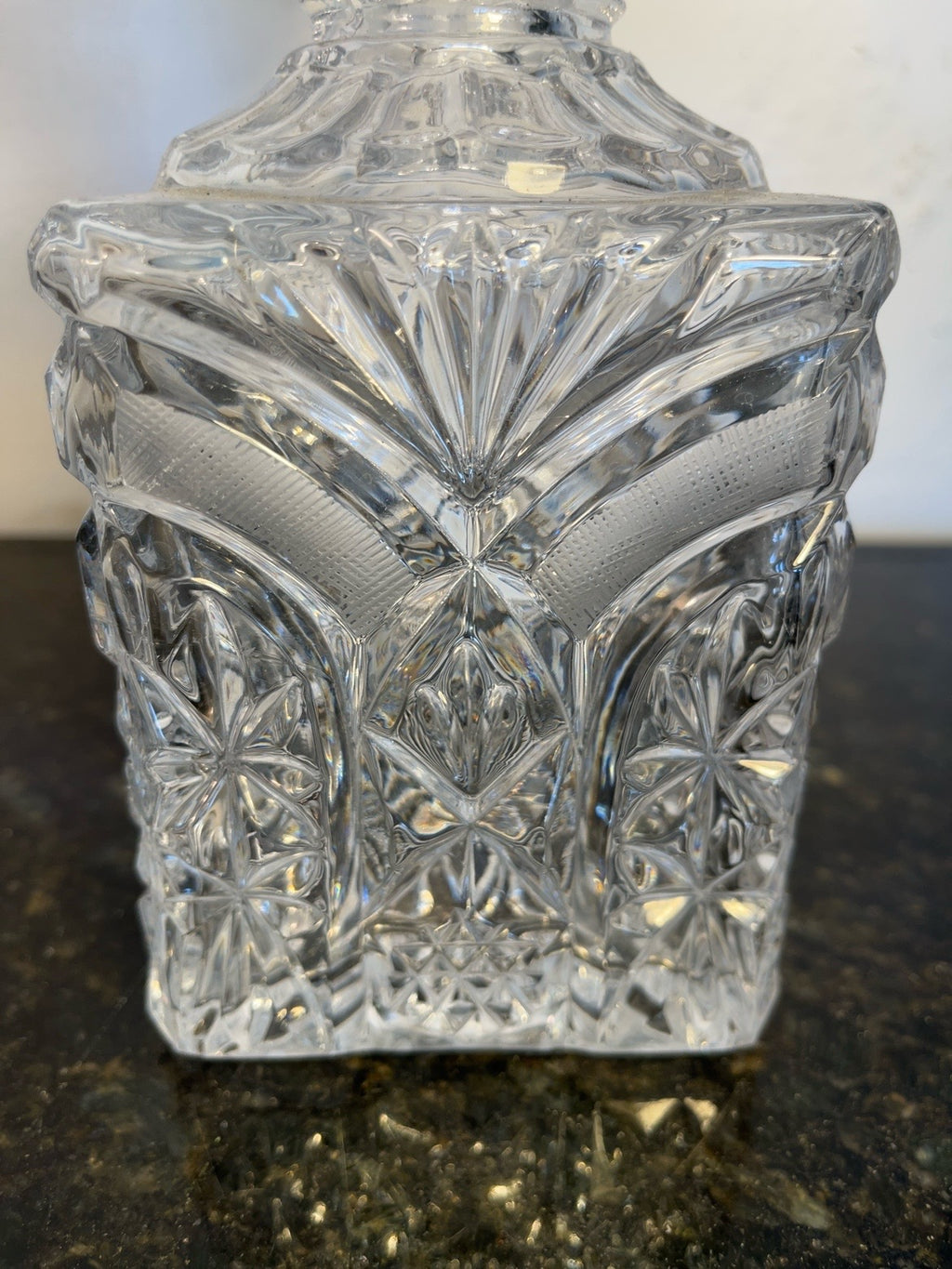 Close-up of the starburst cut crystal pattern on the decanter body