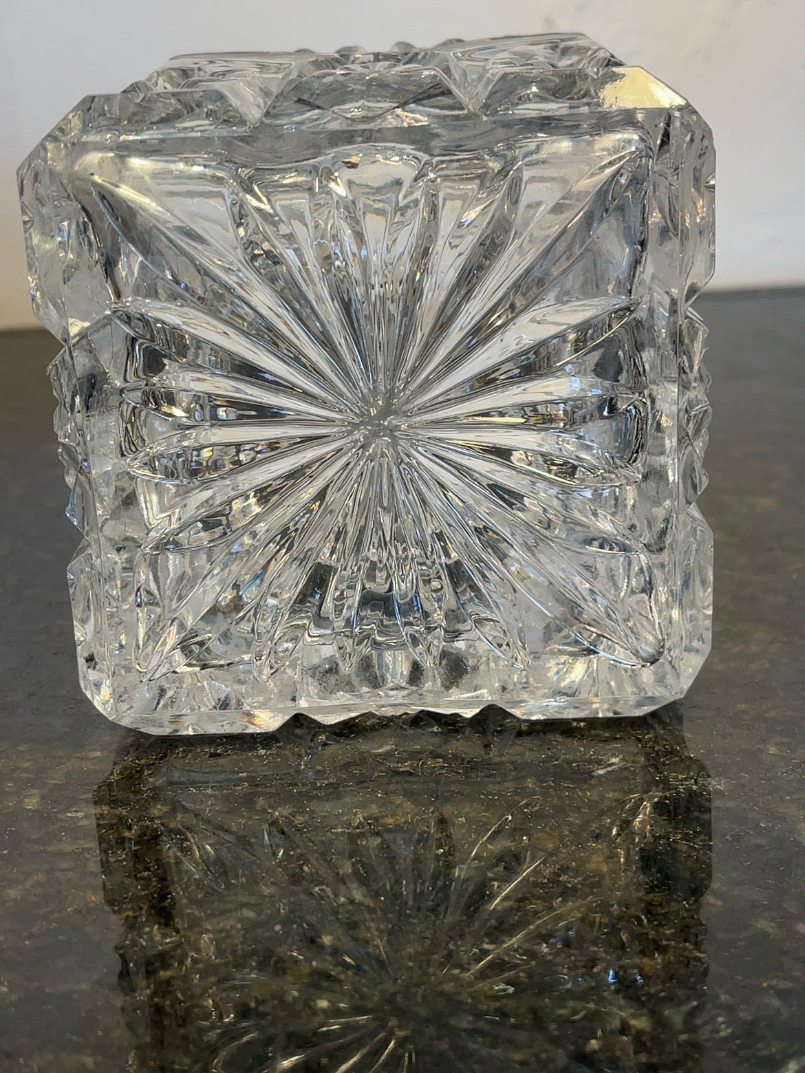 Detail of the starburst pattern cut into the base of the decanter