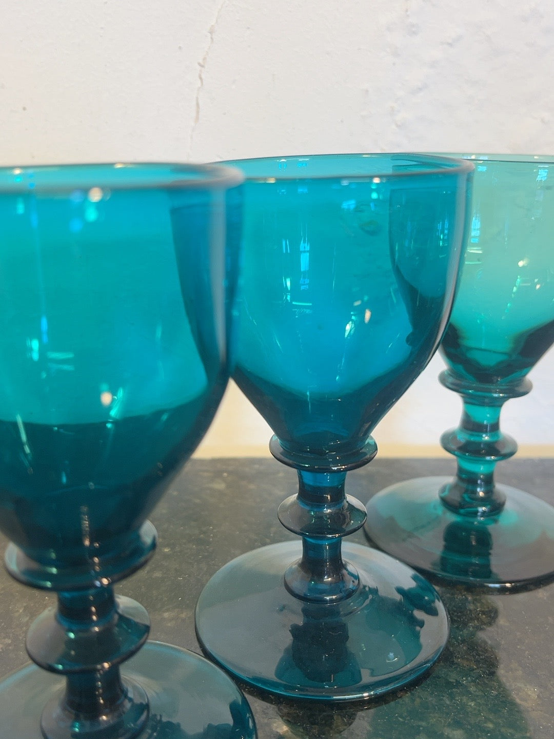 Close view of peacock-blue glass bowls