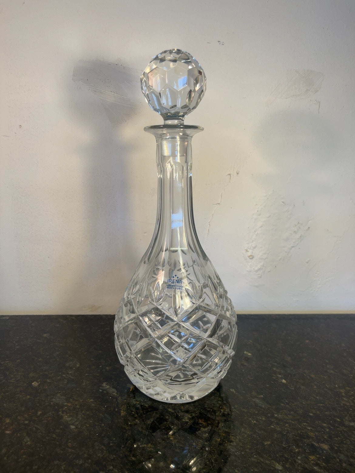 Irena cut crystal decanter with matching faceted stopper, full front view