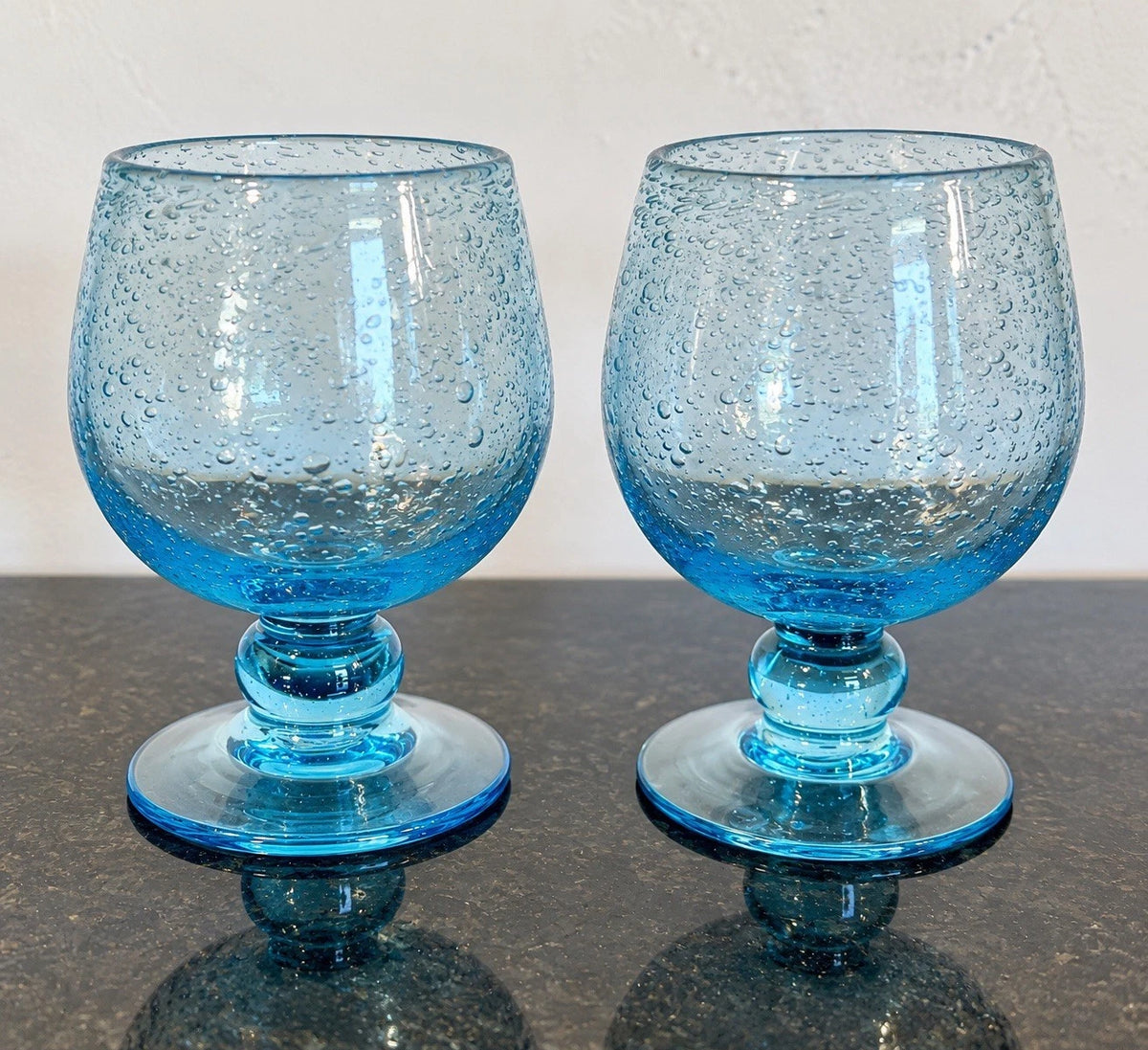Pair of Biot France blue bubble gin goblets, full front view