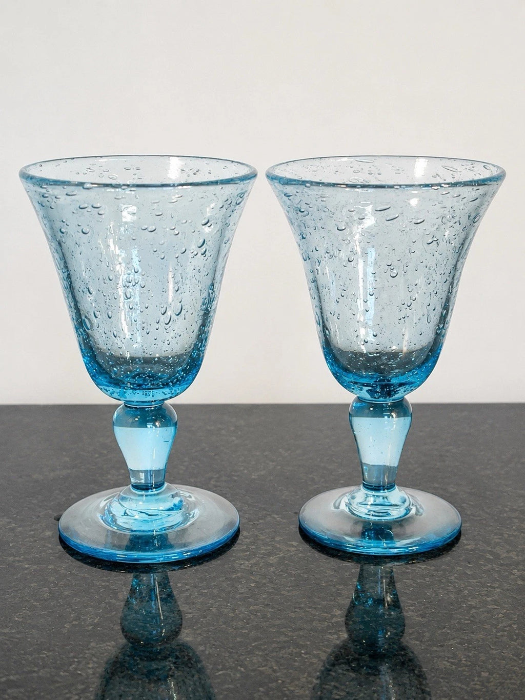 Pair of Biot France blue bubble wine goblets, full front view