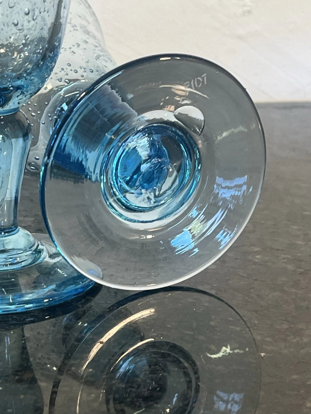 Biot signature detail on the base of a blue wine goblet