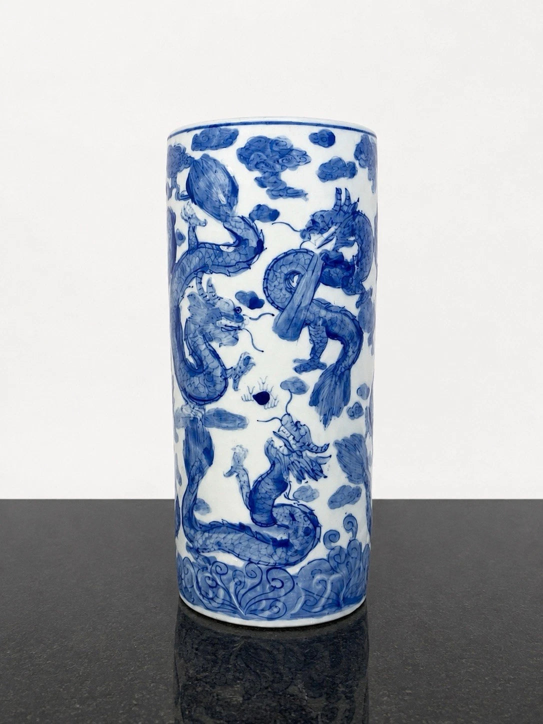 Full view of the Chinese blue and white relief dragon sleeve vase