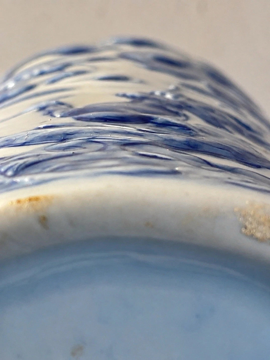 Close view of the raised dragon decoration on the Chinese porcelain vase