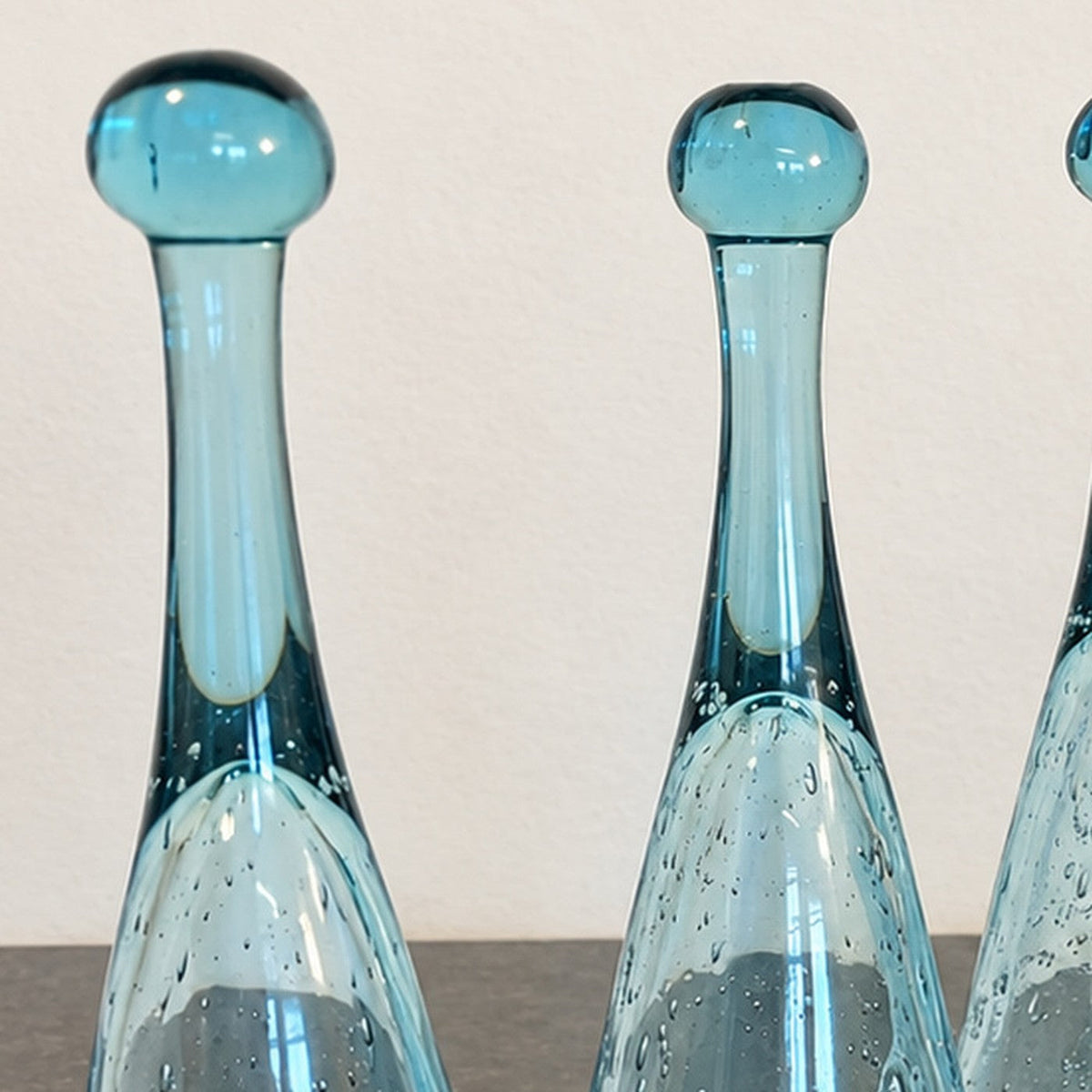 Original photograph detail showing blue glass stems and rounded ends
