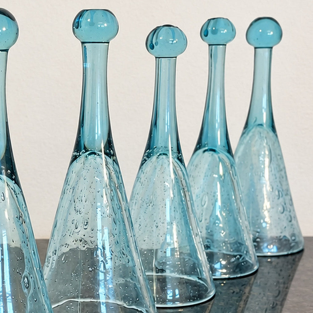 Original set photograph detail showing multiple blue pomponnette glasses