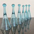 Six blue bubble glass champagne glasses, gently brightened original product photograph