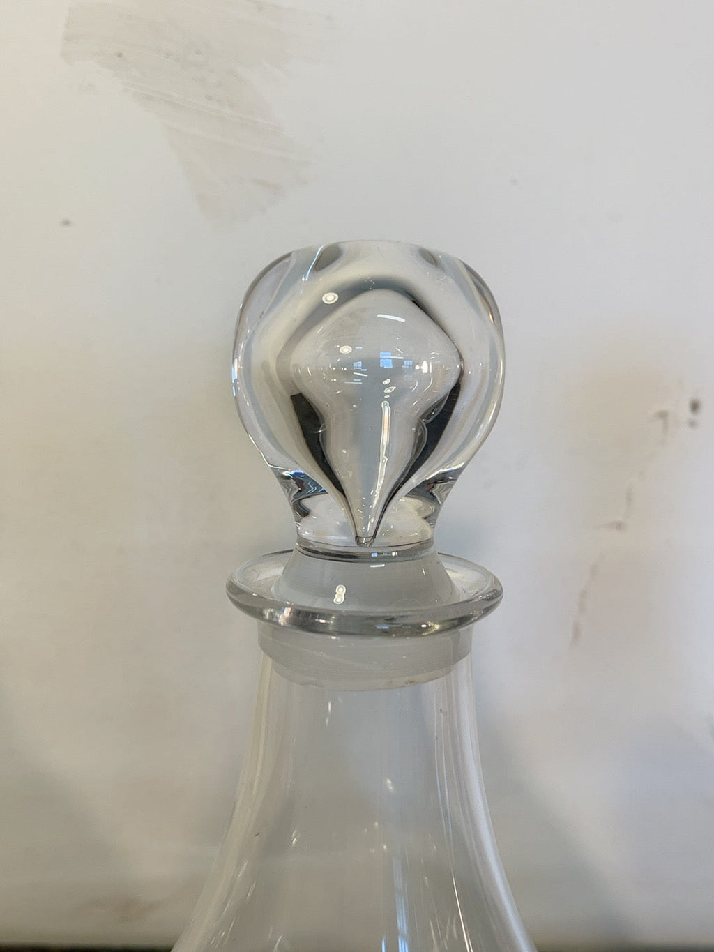 Close-up of looped decanter stopper showing glass details