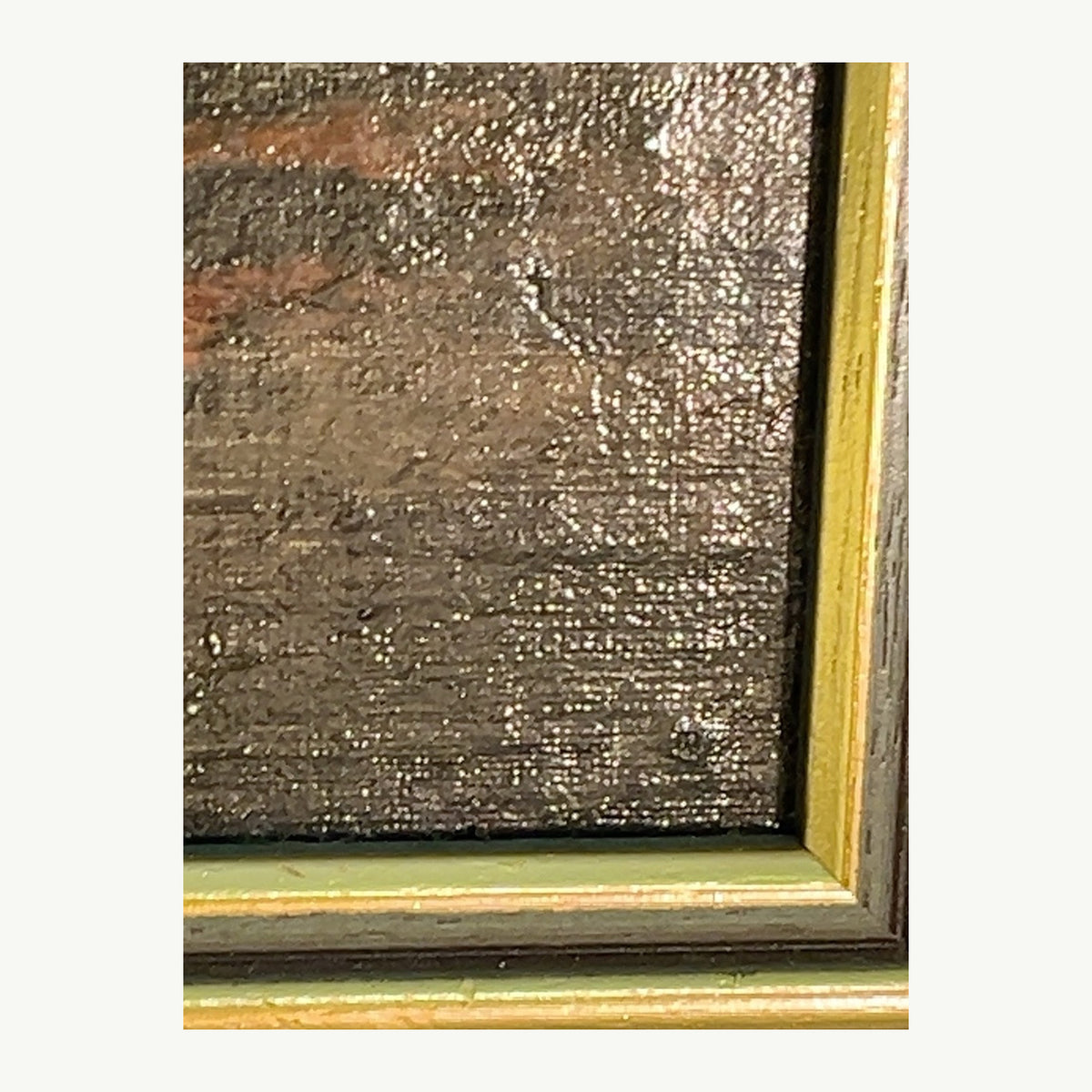 Close-up of painting texture and gilt frame