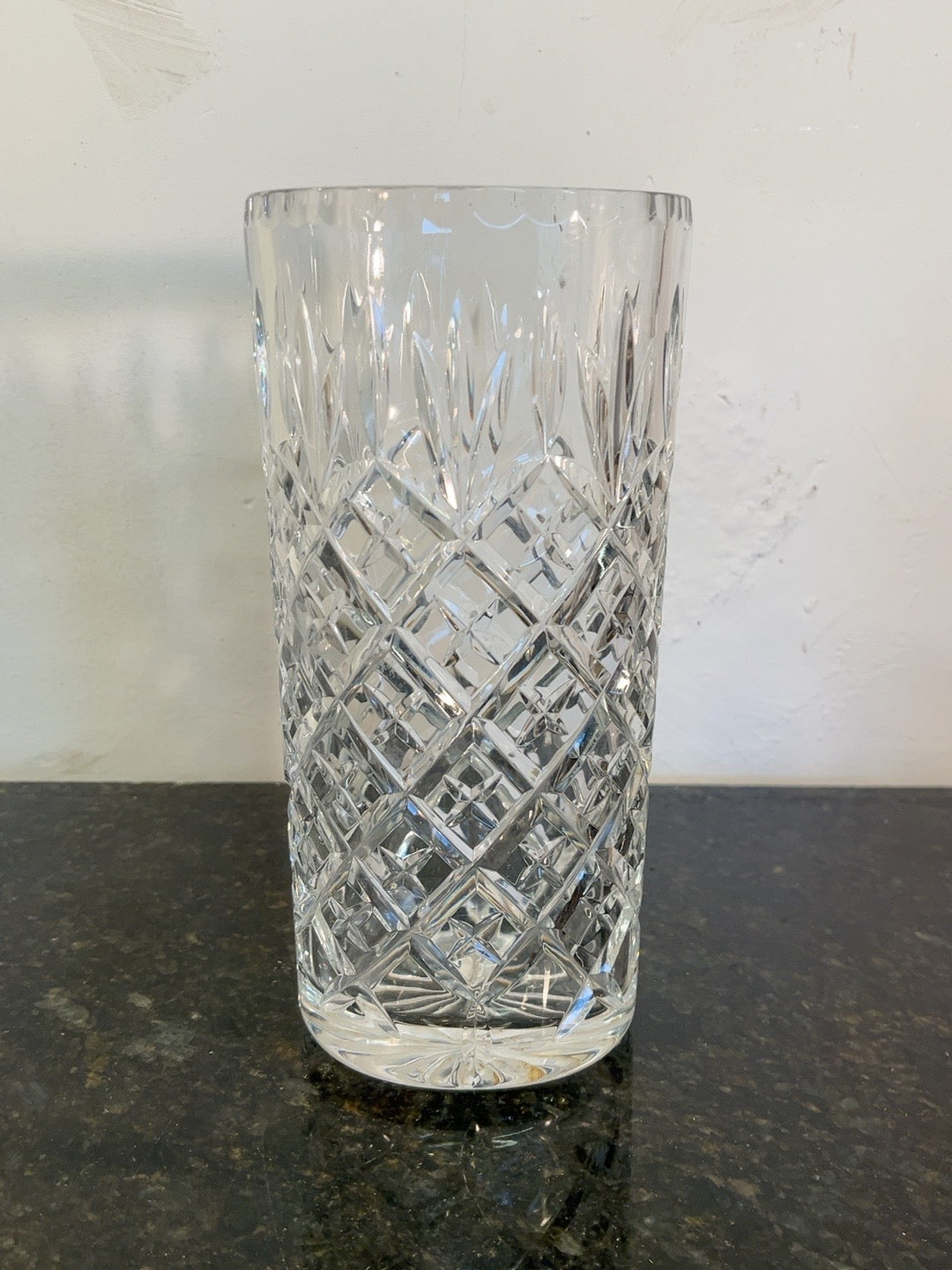 Edinburgh International Autumn cut crystal vase photographed on dark stone