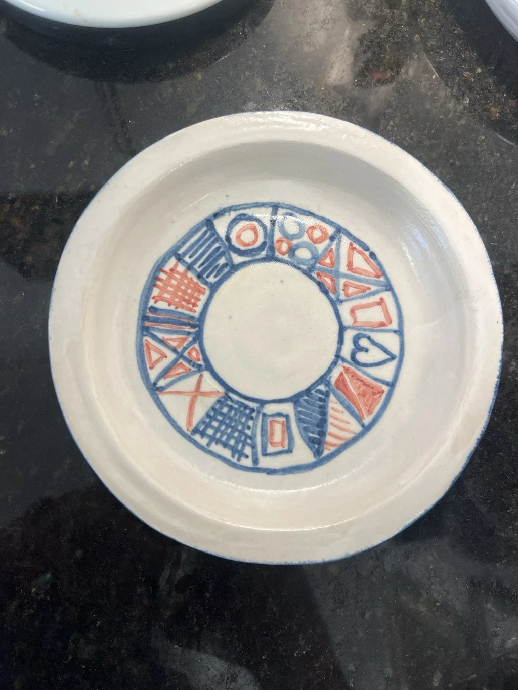French earthenware tableware with blue and red stamped pattern