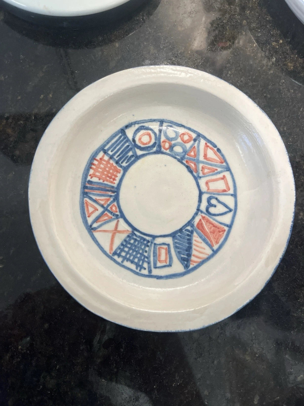 French earthenware tableware with blue and red stamped pattern