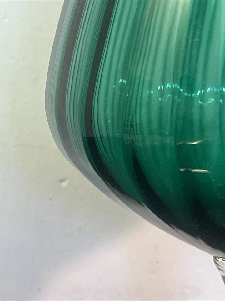 Detail view of the emerald green ribbed glass bowl