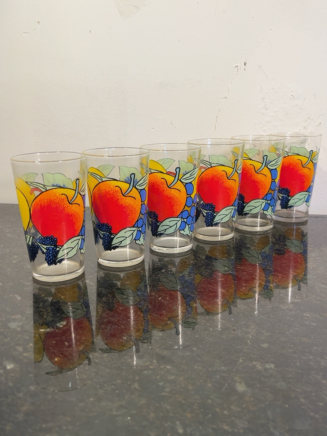 Six colourful retro fruit-pattern tumblers with apple and grape decoration, original photograph