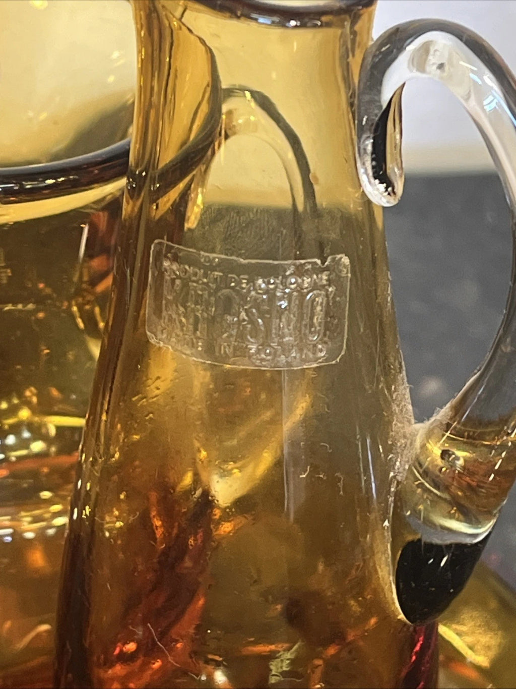 Krosno maker's mark on the amber glass jug