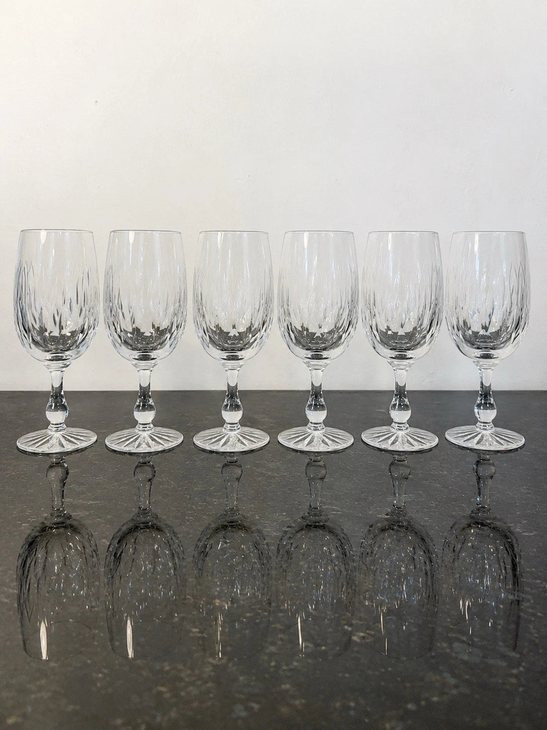 Six Webb Corbett Canterbury crystal water goblets shown together