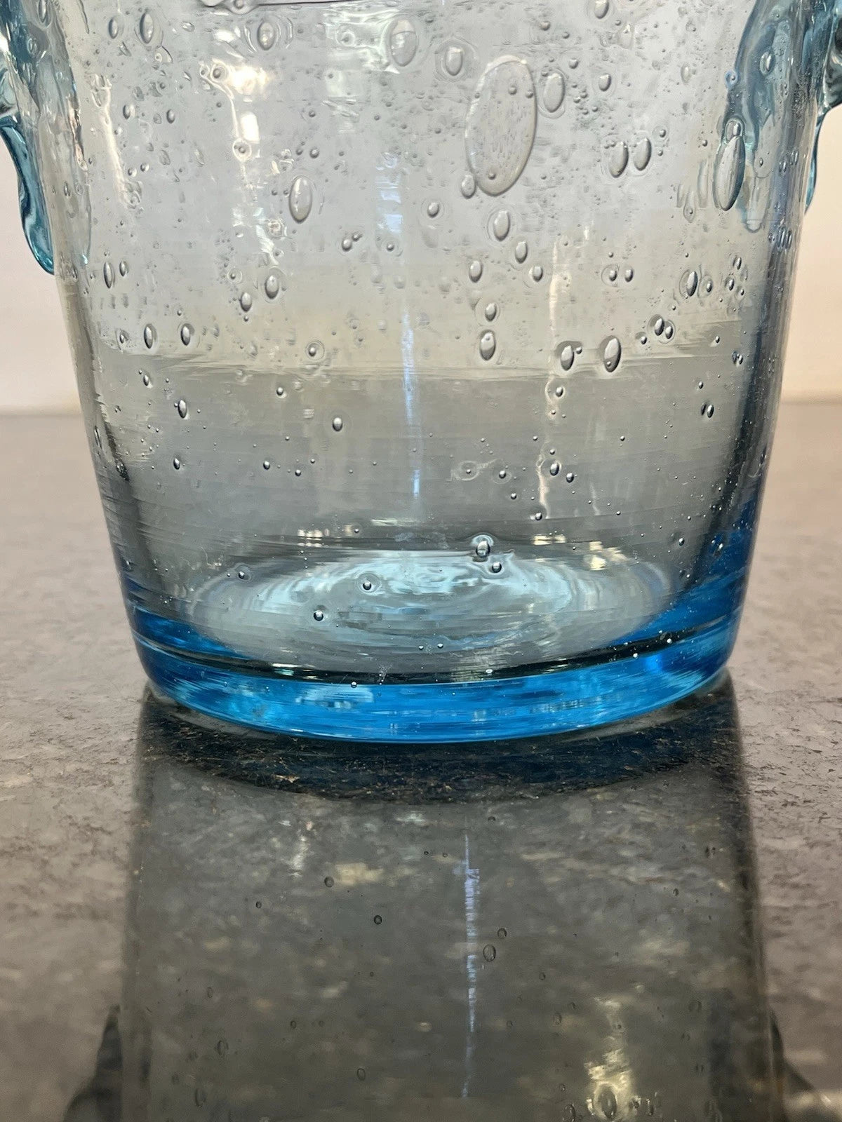 Side view showing the hand-blown bubbles and blue base