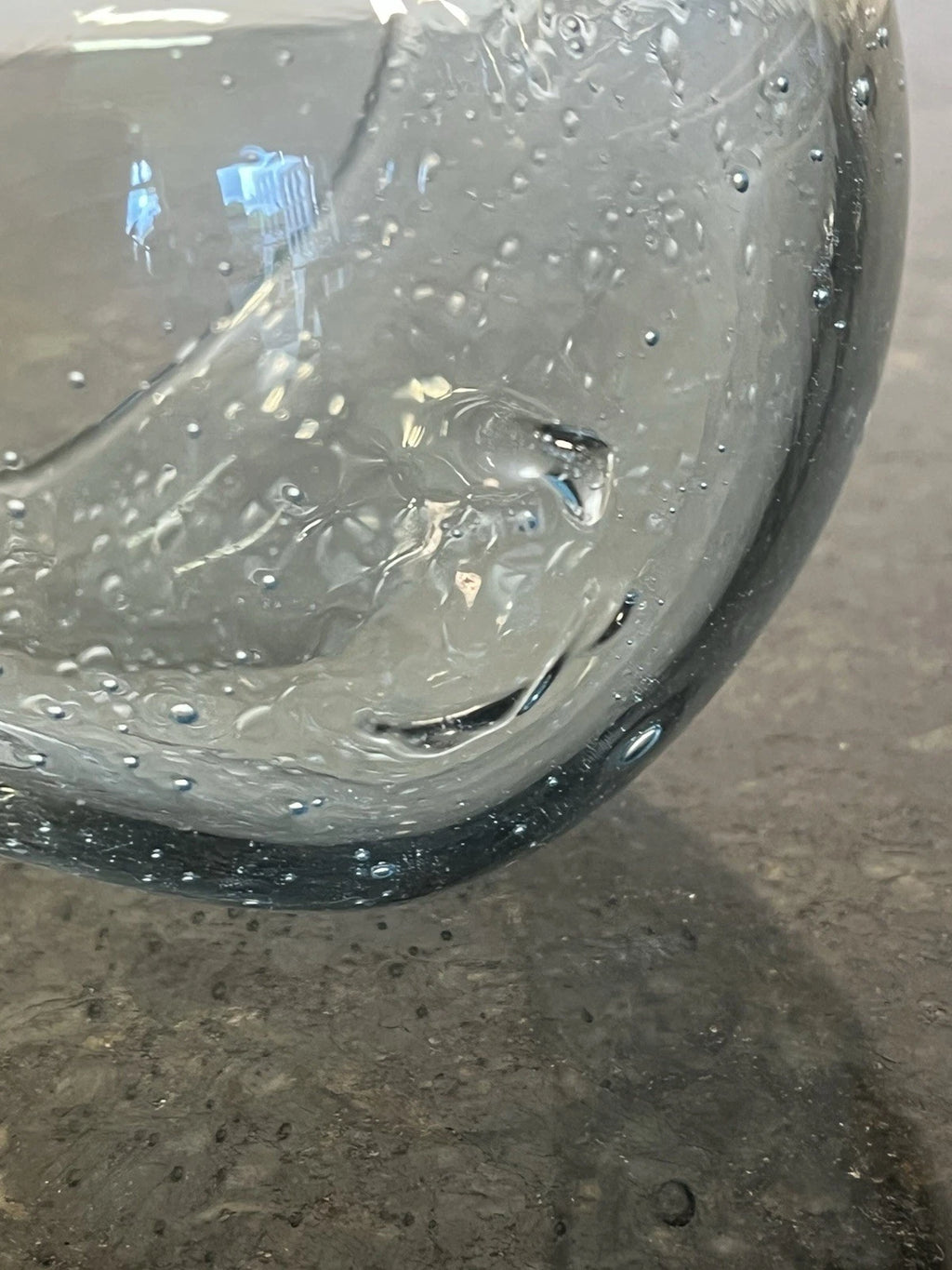 Close view of the glass bubbles and curved bowl surface