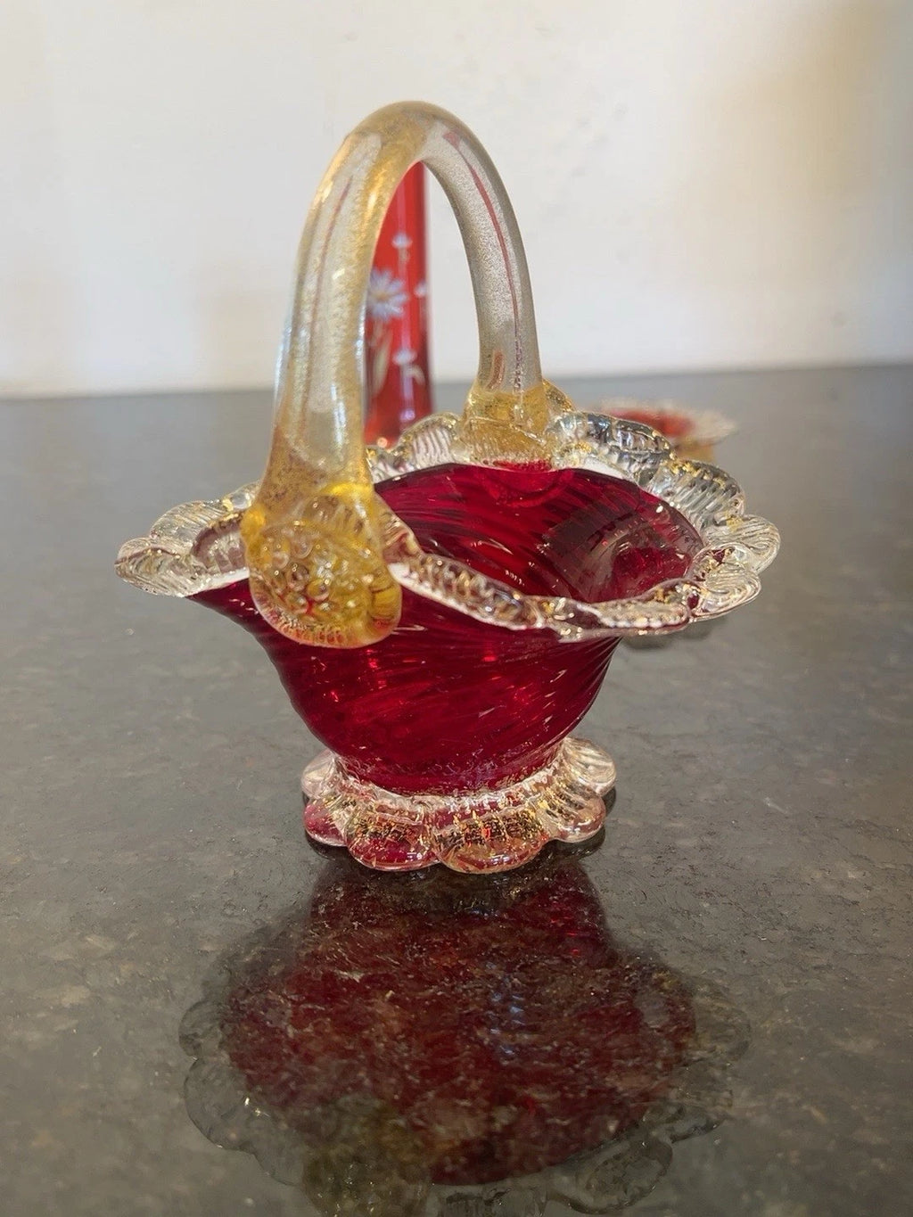 Handled cranberry and amber glass basket from the trio