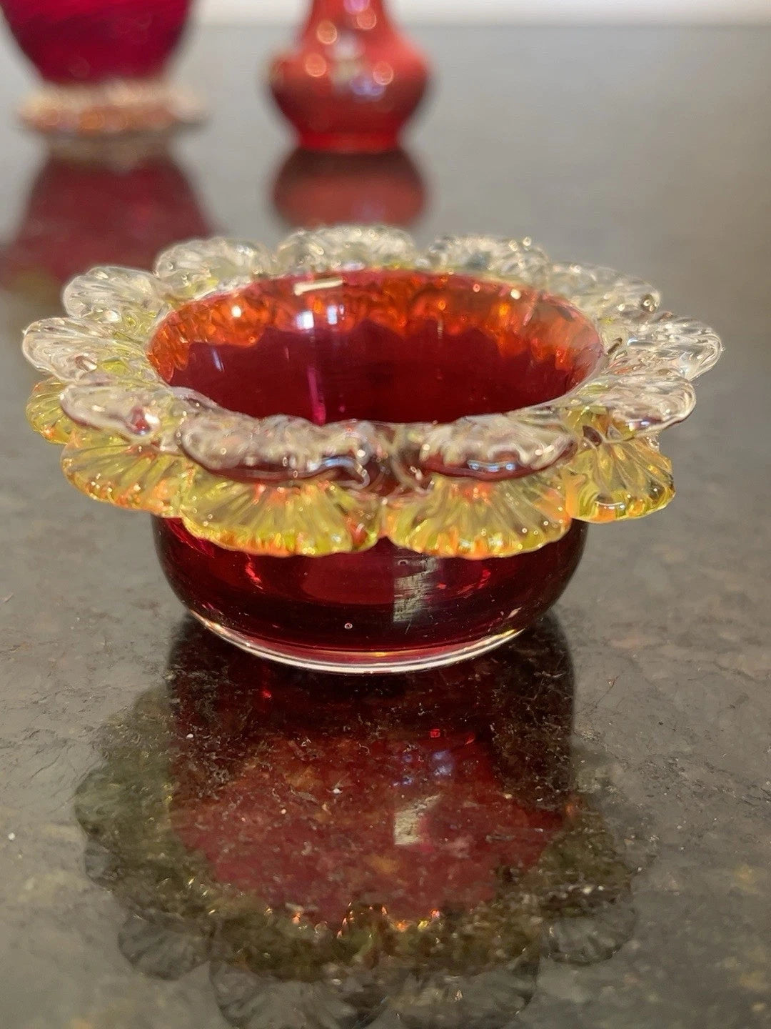 Scalloped cranberry and amber glass bowl from the trio