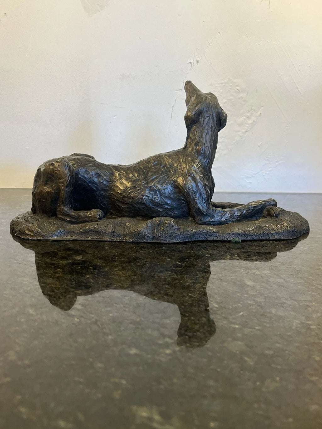 Cold cast bronze hound sculpture, underside and label