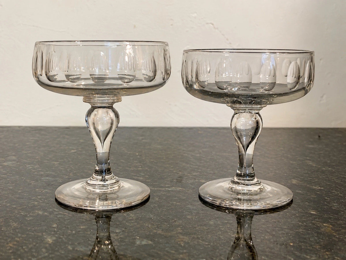 Pair of Victorian hand-blown olive-cut champagne coupes, full view