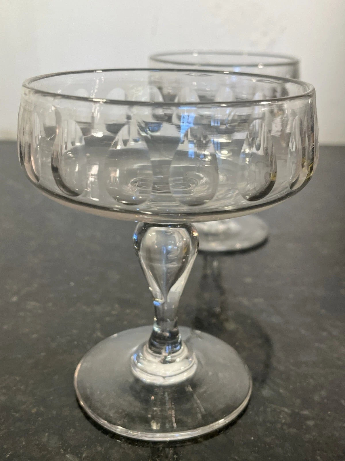 Olive-cut coupe bowls and air-tear stems detail