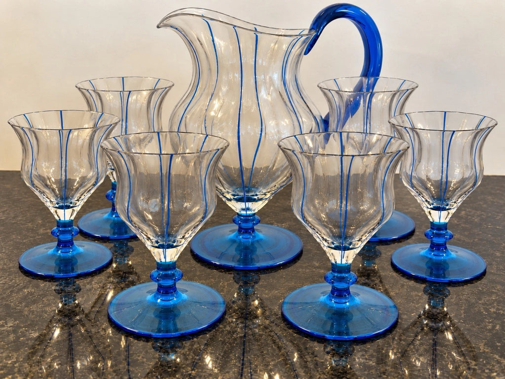 Blue art glass jug and five matching goblets, full set