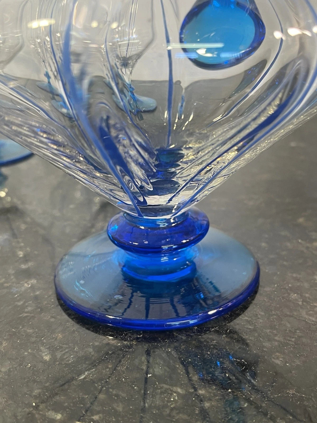 Close detail of the blue art glass jug and goblets
