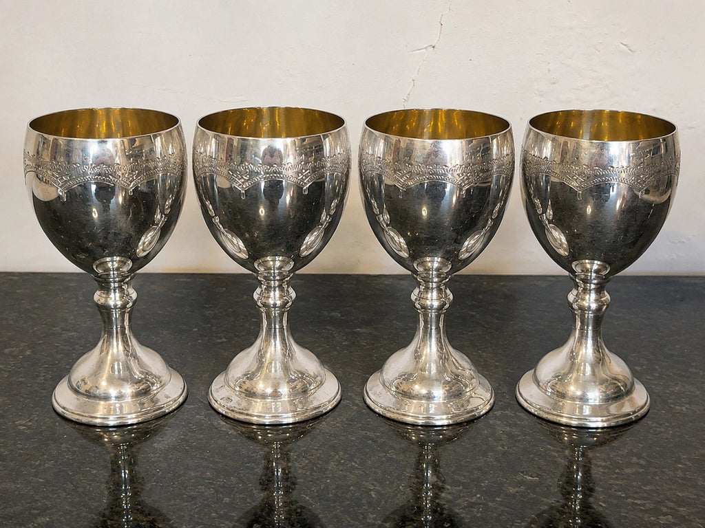 Set of four silver-plated Masonic goblets with gilt interiors, full view