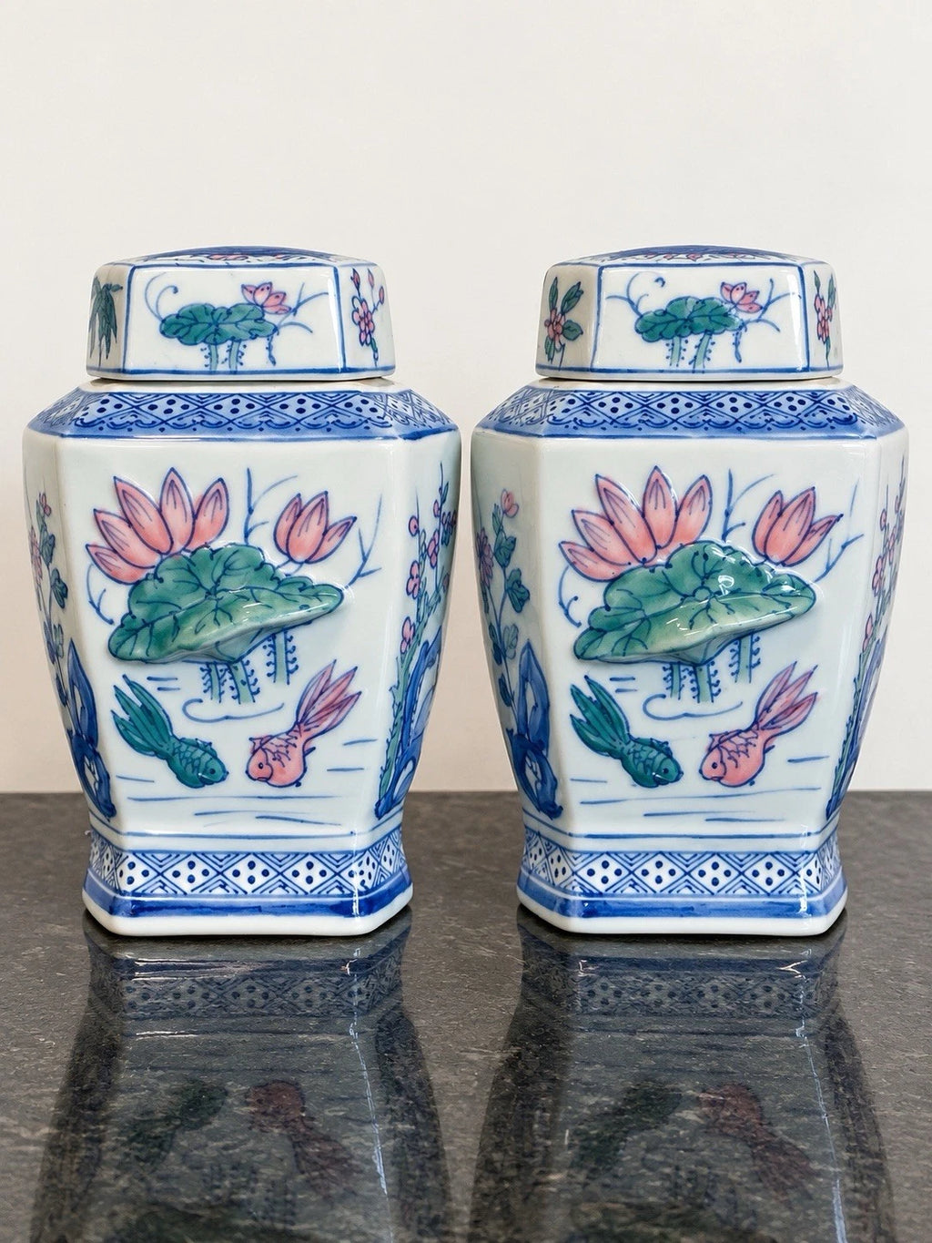Pair of Chinese porcelain ginger jars with lotus and fish, full view