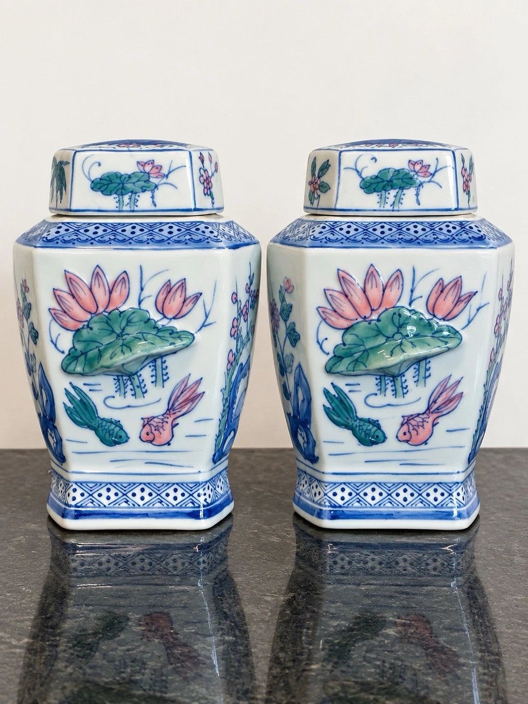 Pair of Chinese porcelain ginger jars with lotus and fish, full view