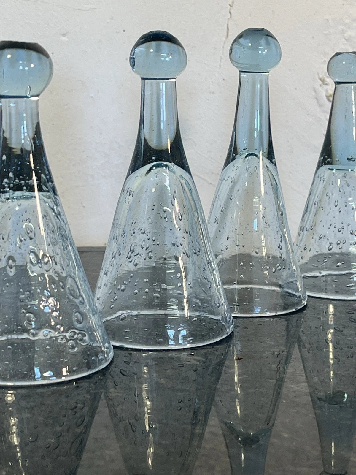 Pale blue bubbled glass and hand-blown form