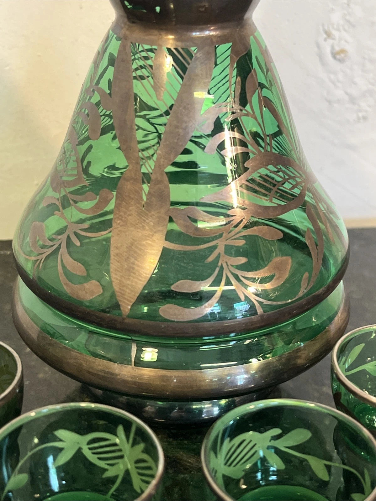 Close-up of the decanter's metallic overlay