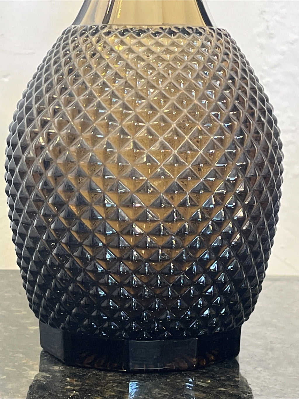Detail of the smoky grey diamond hobnail cut body
