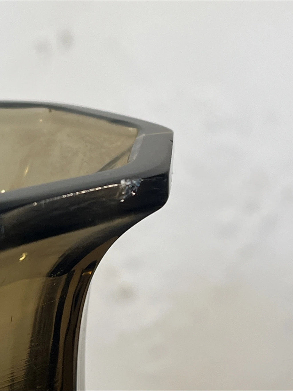 Close-up showing the small chip to the upper rim